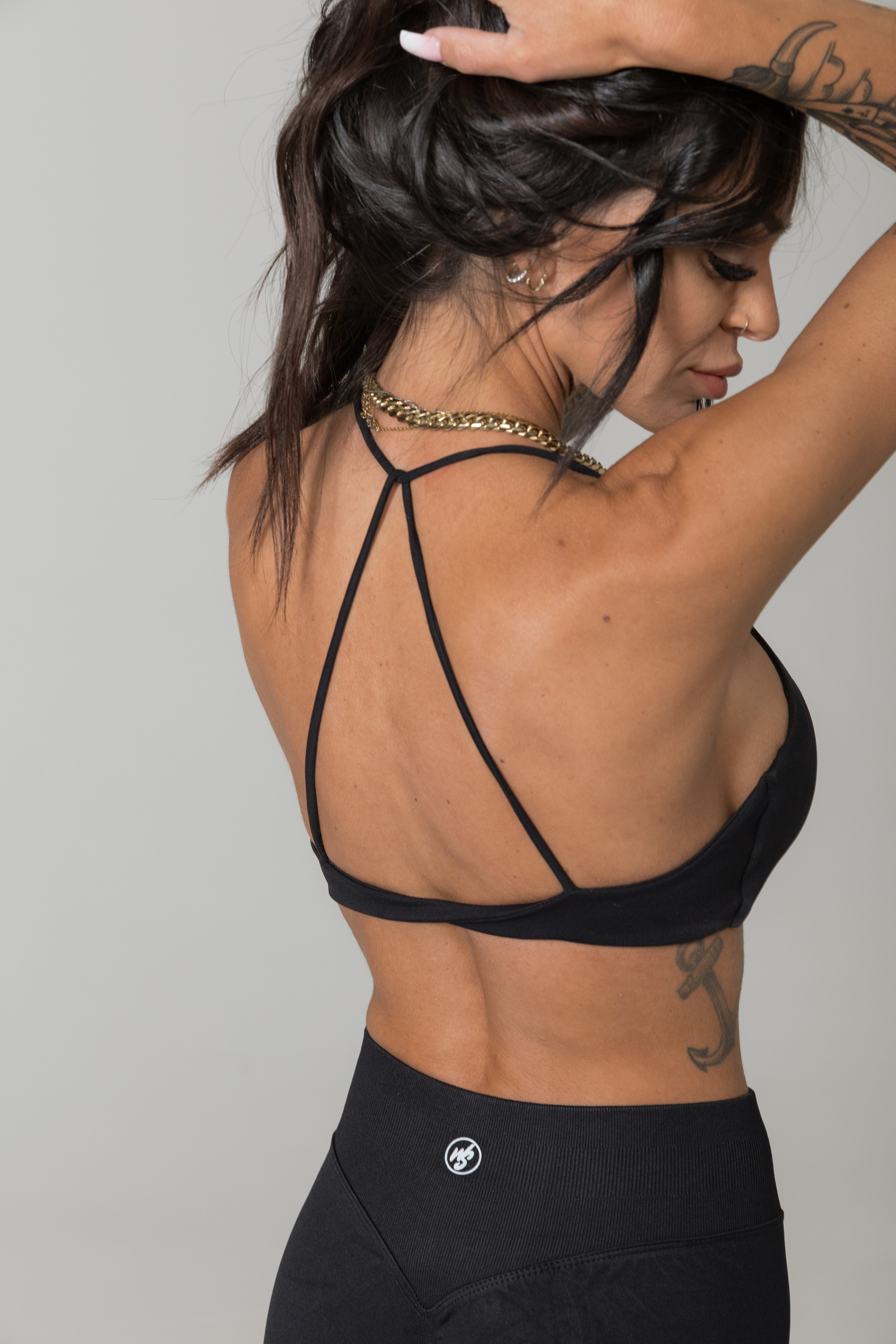 Black minimal strap sports bra women moisture wicking activewear